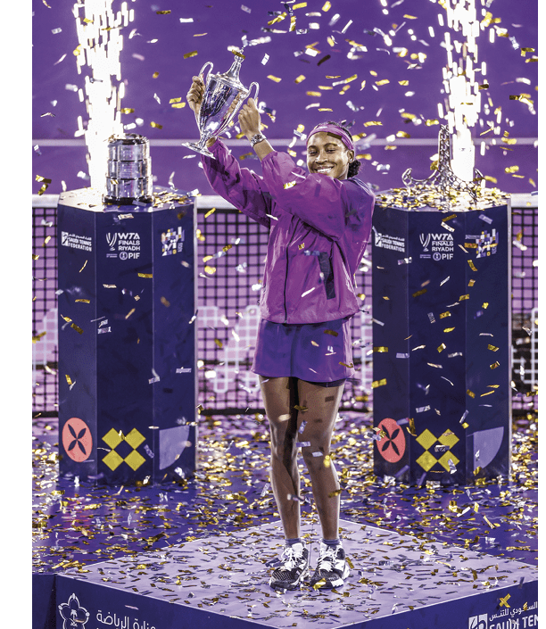 RIYADH, SAUDI ARABIA - NOVEMBER 09: Coco Gauff of the United States celebrates with the Billie Jean King trophy after her win against Qinwen Zheng of China in their Women's Singles Final match during the 2024 WTA Finals Riyadh as part of the Hologic WTA Tour at King Saud University Indoor Arena on November 09, 2024 in Riyadh, Saudi Arabia. (Photo by Katelyn Mulcahy/Getty Images for WTA)