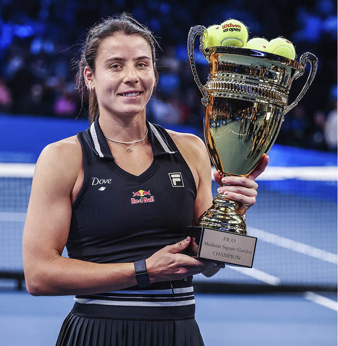 NEW YORK, NEW YORK - DECEMBER 04: Emma Navarro of the United States of America holds the winners trophy after defeating  Jessica Pegula of the United States of America in straight sets during their exhibition match during the Garden Cup at Madison Square Garden on December 04, 2024 in New York City. (Photo by Al Bello/Getty Images)