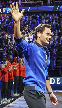 LONDON, ENGLAND - SEPTEMBER 25: Roger Federer of Team Europe acknowledges the fans as they enter centre court during Day Three of the Laver Cup at The O2 Arena on September 25, 2022 in London, England. (Photo by Julian Finney/Getty Images for Laver Cup)