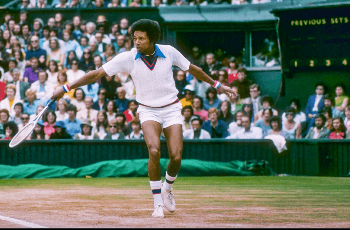 Arthur Ashe runs for the ball during a match at Wimbledon in England. (Photo by Tony Duffy/Getty Images)