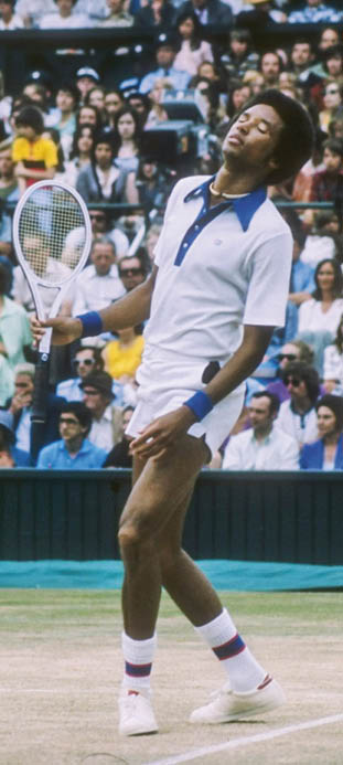 Jul 1975: Arthur Ashe looks dejected during a match against Jimmy Connors at the Wimbledon Open in Great Britain. Mandatory Credit: Allsport  /Allsport