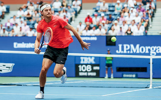 NEW YORK, NEW YORK - SEPTEMBER 05: Taylor Fritz of the United States chases down a ball during his Men's Singles Quarterfinal match against Novak Djokovic of Serbia on Day Nine of the 2023 US Open at the USTA Billie Jean King National Tennis Center on September 05, 2023 in the Flushing neighborhood of the Queens borough of New York City. (Photo by Al Bello/Getty Images)
