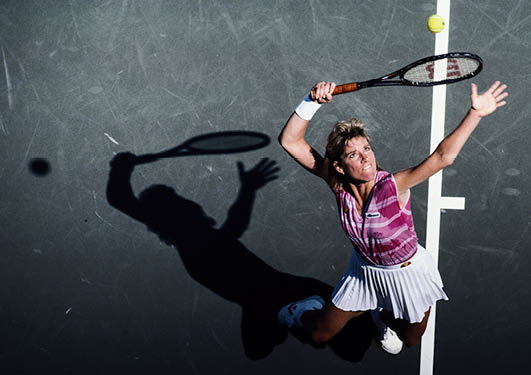 Chris Evert- Lloyd of the United States serves to Claudia Kohde-Kilsch during their Women's Singles Quarter-Final match of the US Open Tennis Championship on 3 September 1985 at the USTA National Tennis Center in the Flushing neighbourhood of Queens in New York, United States. (Photo by Trevor Jones/Allsport/Getty Images)