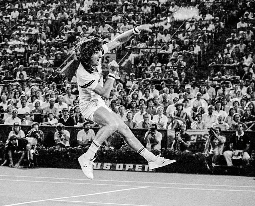 Black and white action shot of Jimmy Connors during the US Open at the National Tennis Center in Flushing, New York