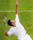 NEWPORT, RI - JULY 5: Taylor Dent of the USA returns a serves during his match against Amer Delic of the USA on July 5, 2005 in the first round of the Campbell's Hall of Fame Tennis Championships at the Tennis Hall of Fame in Newport, Rhode Island. Dent won 7-6, 6-4.  (Photo by Ezra Shaw/Getty Images)