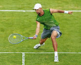 NEWPORT, RI - JULY 5: James Blake of the USA returns a shot during his match against Antony Dupuis of France during the first round of the Campbell's Hall of Fame Tennis Championships on July 5, 2005 at the Tennis Hall of Fame in Newport, Rhode Island.  (Photo by Ezra Shaw/Getty Images)