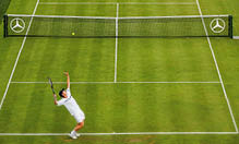NEWPORT, RI - JULY 5: Andrew Murray of Great Britain serves the ball during his match against Gregory Carraz of France on July 5, 2005 in the first round of the Campbell's Hall of Fame Tennis Championships at the Tennis Hall of Fame in Newport, Rhode Island. Murray won the match  6-4, 7-5.  (Photo by Ezra Shaw/Getty Images)
