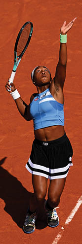 PARIS, FRANCE - JUNE 05: Coco Gauff of United States serves against Karolina Anna Schmiedlova of Slovakia during the Women's Singles Fourth Round match on Day Nine of the 2023 French Open at Roland Garros on June 05, 2023 in Paris, France. (Photo by Clive Mason/Getty Images)