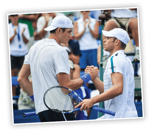WINSTON-SALEM, NC - AUGUST 26: (L-R) John Isner of the USA shakes hands with Andy Roddick of the USA after defeating Roddick in the semifinals of the Winston-Salem Open at the Wake Forest University Tennis Complex on August 26, 2011 in Winston-Salem, North Carolina.  (Photo by Streeter Lecka/Getty Images)