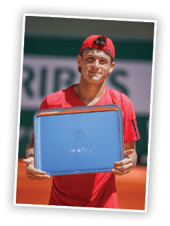 PARIS, FRANCE - JUNE 06: Tommy Paul of the United States poses with the trophy after the Boy's Singles Final against Taylor Harry Fritz of United States on day fourteen of the 2015 French Open at Roland Garros on June 6, 2015 in Paris, France.  (Photo by Dan Istitene/Getty Images)
