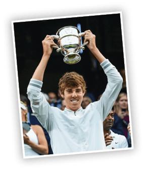 LONDON, ENGLAND - JULY 12: Reilly Opelka of the United States celebrates with the trophy after winning in the Final of the Boys Singles against Mikael Ymer of Sweden during day thirteen of the Wimbledon Lawn Tennis Championships at the All England Lawn Tennis and Croquet Club on July 12, 2015 in London, England.  (Photo by Shaun Botterill/Getty Images)